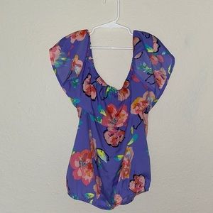 Purple off the shoulder top. With pink flowers.